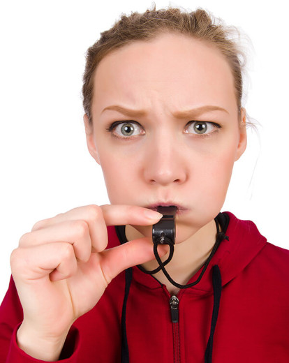 woman blowing whistle